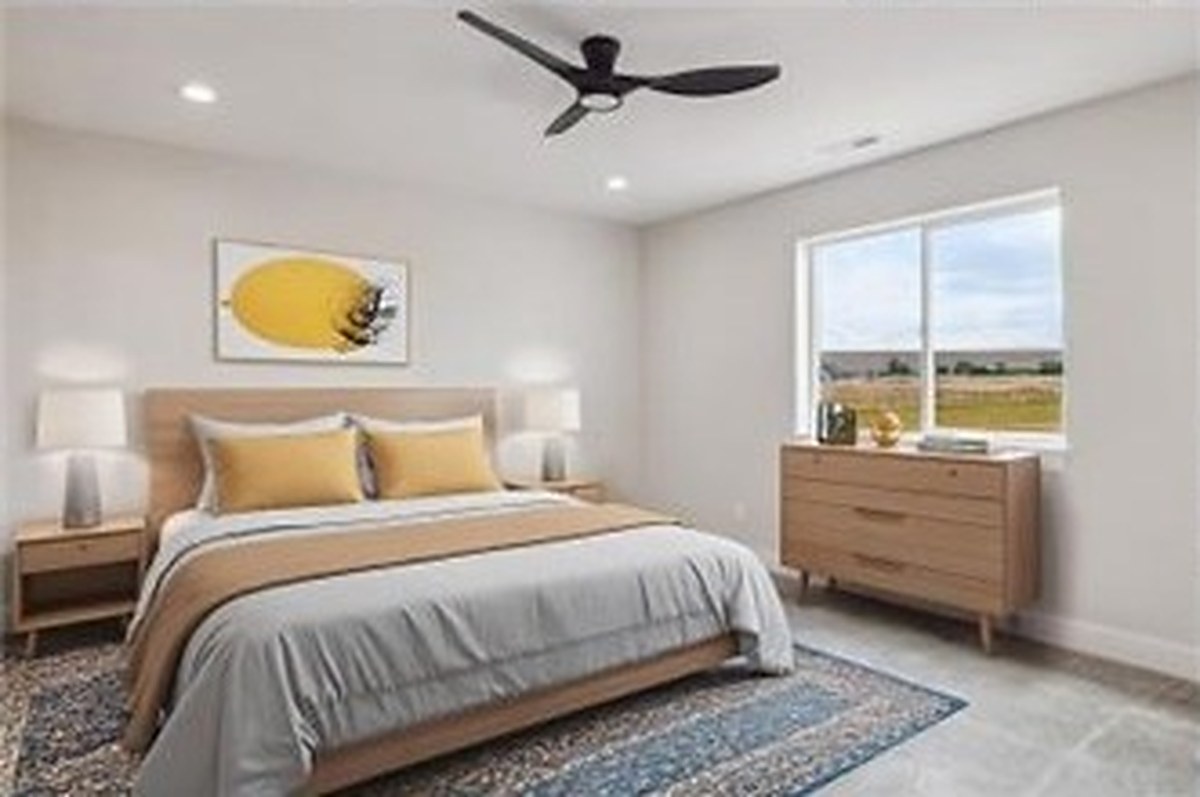 Staged bedroom with meadow window view